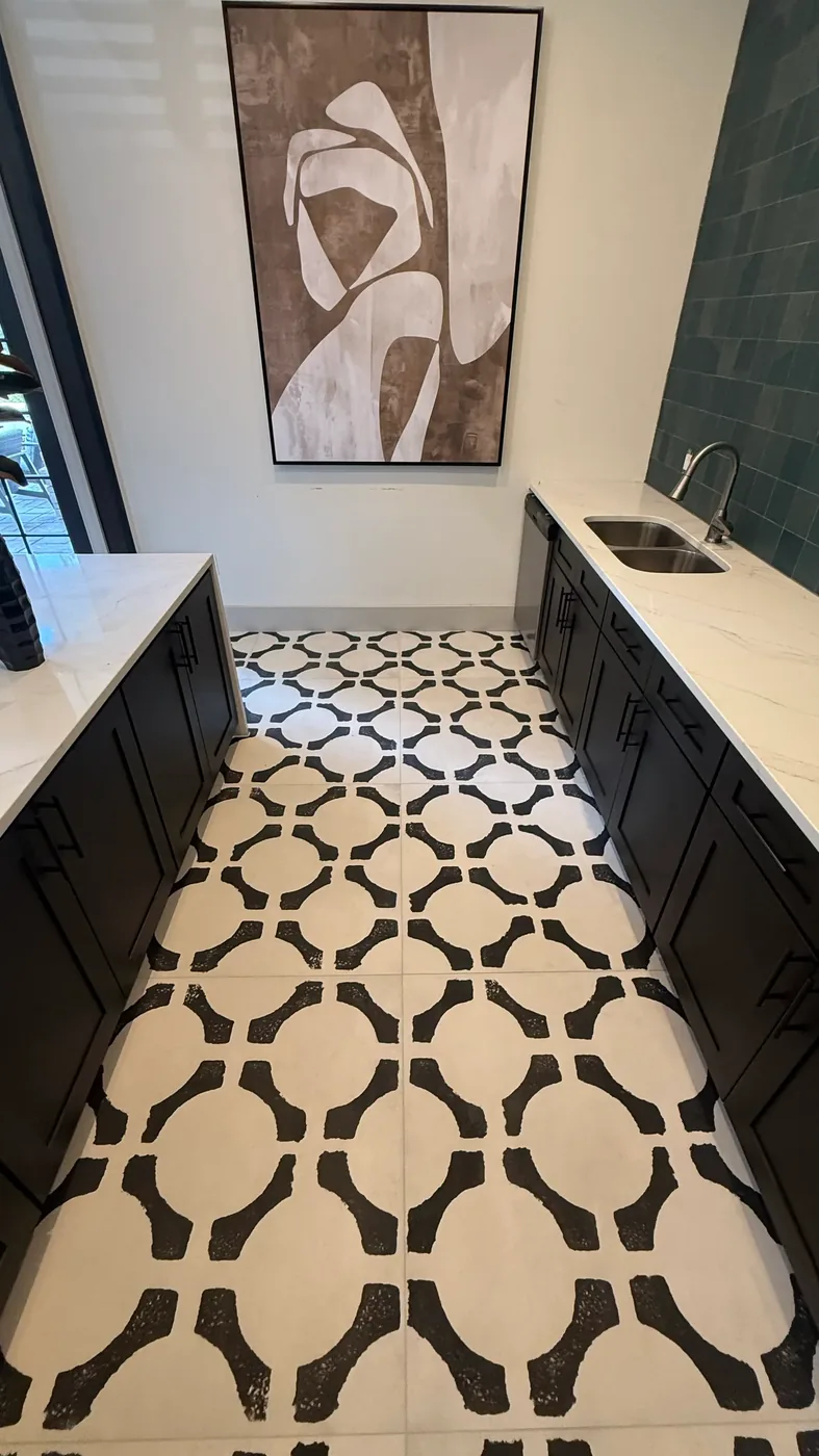 Teal square tile feature wall over a wet bar with dark cabinets in Chapel Hill commercial space